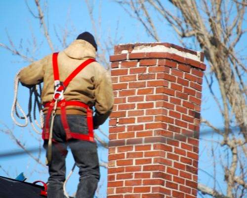 exemple de pose de chapeau de cheminée en béton